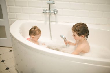 Brothers bathe in the bathroom
