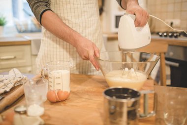 Young man bakes cookies