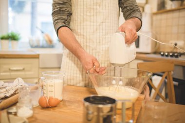 Young man bakes cookies