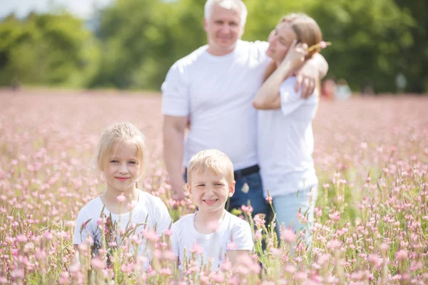 Family on holiday in the village — ストック写真