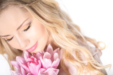 Luxurious blonde with a bouquet of tulips