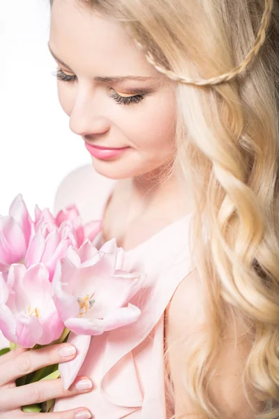 Luxurious blonde with a bouquet of tulips — Stock Photo, Image