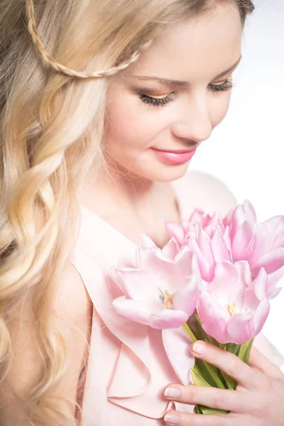 Luxurious blonde with a bouquet of tulips — Stok fotoğraf