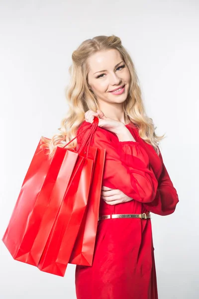 Chica con paquetes rojos —  Fotos de Stock