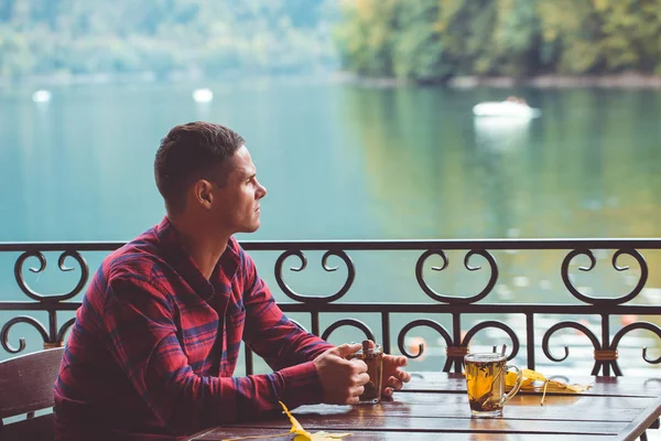 Man with cup of herbal tea — Stock Photo, Image