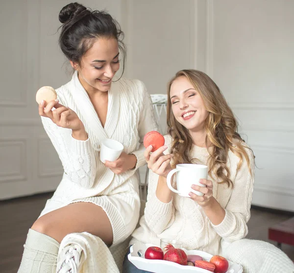 Girl in a chair with a cup — Stock Photo, Image