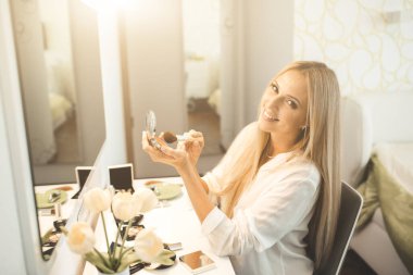 Young beautiful woman with cosmetics