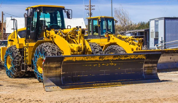 Two Bulldozers With Snow Tires In Springtime — Stock Photo, Image