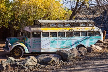 Old Converted School Bus In Salvage Yard clipart