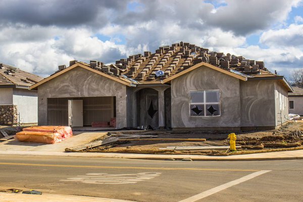 New One Story Home Construction With Recently Applied Stucco