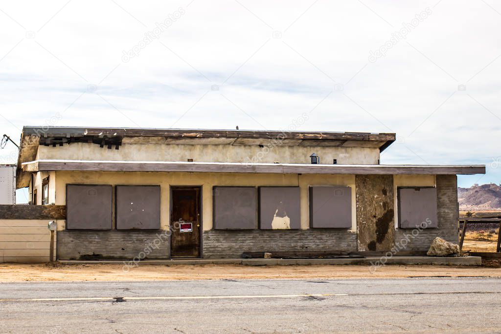 Failed Commercial Building With Boarded Up Windows