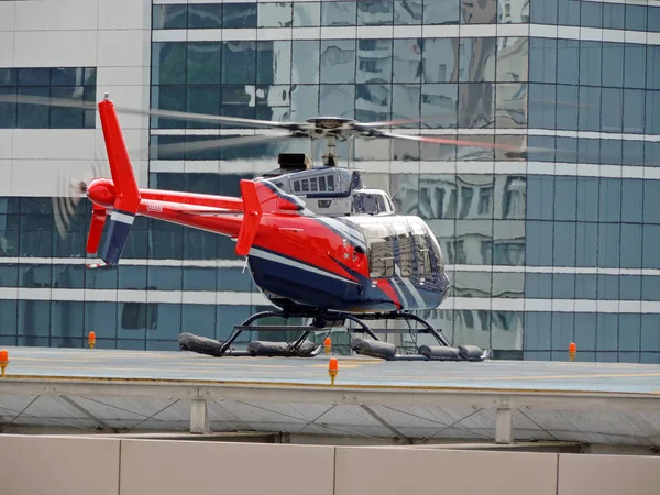 Helicopter perched on helipad — Stock Photo, Image