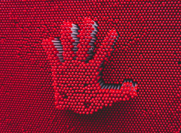 Embossed red hand palm