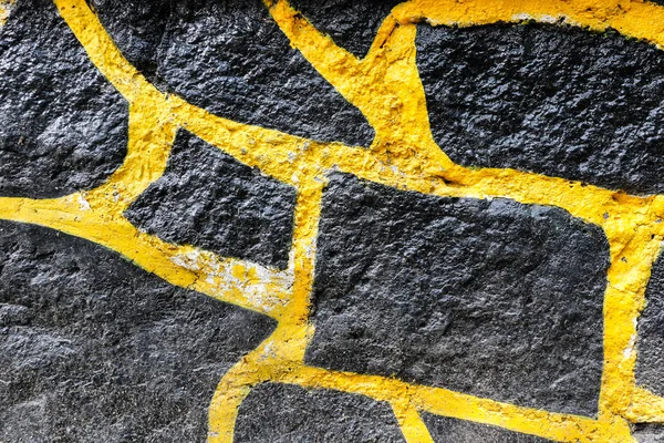 검정색과 노란색 바위 벽 텍스처 — 스톡 사진