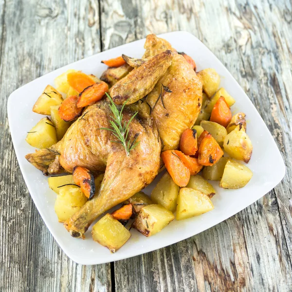 Roasted chicken with potatoes and carrots