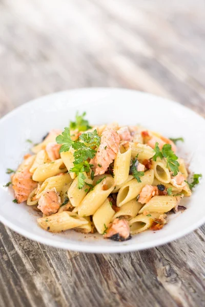 Dish of Italian Pasta with cooked salmon meat
