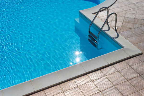 swimming pool with water and sun reflections
