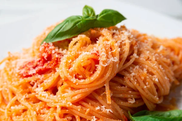 Dish of tomato spaghetti with cheese, Italian food