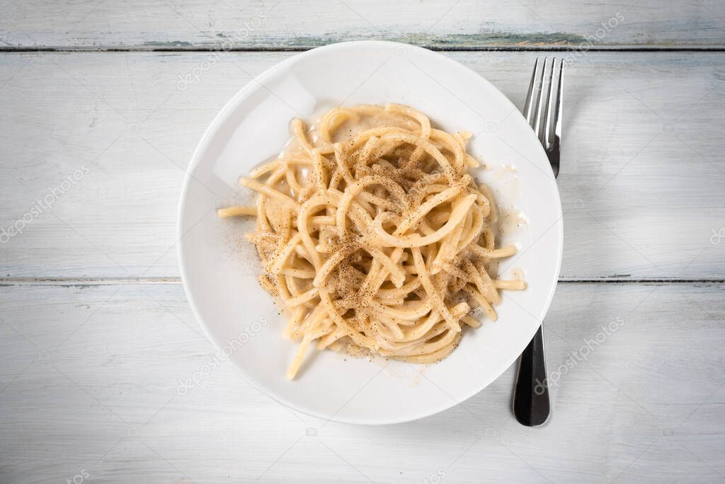 Pici Cacio & Pepe, dish of typical italian pasta with cheese and pepper, Tuscany Food 