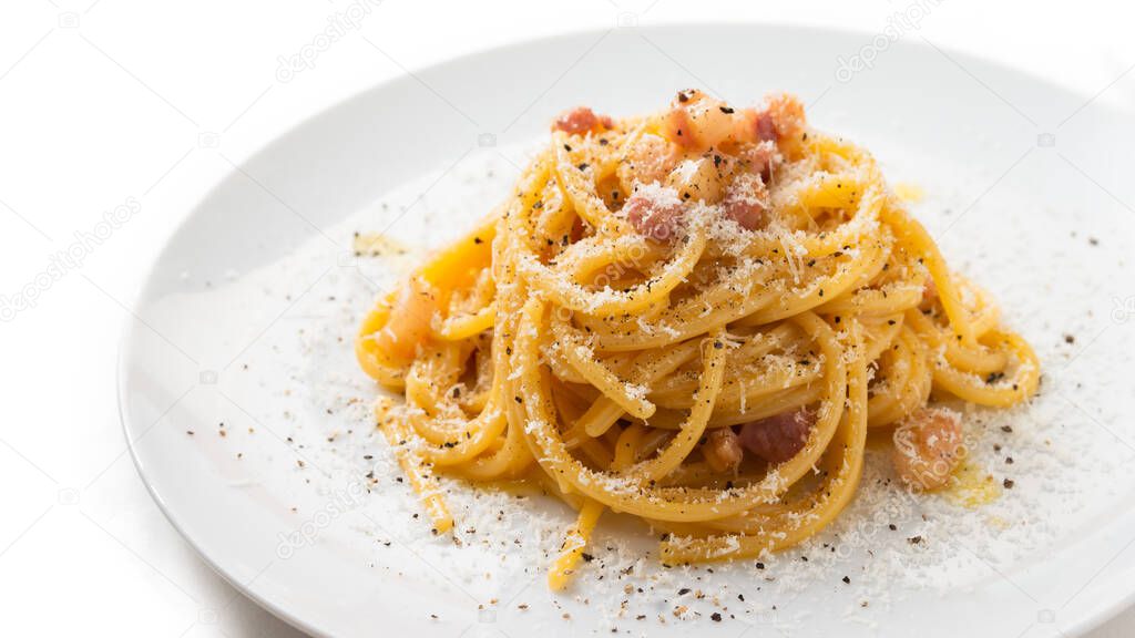 Dish of delicious spaghetti alla carbonara, typical recipe of pasta with guanciale, pecorino and egg sauce, Italian Cuisine 