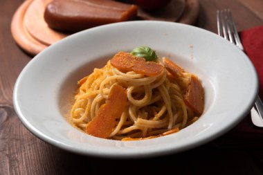 Delicious spaghetti  with bottarga, typical sardinian food  clipart