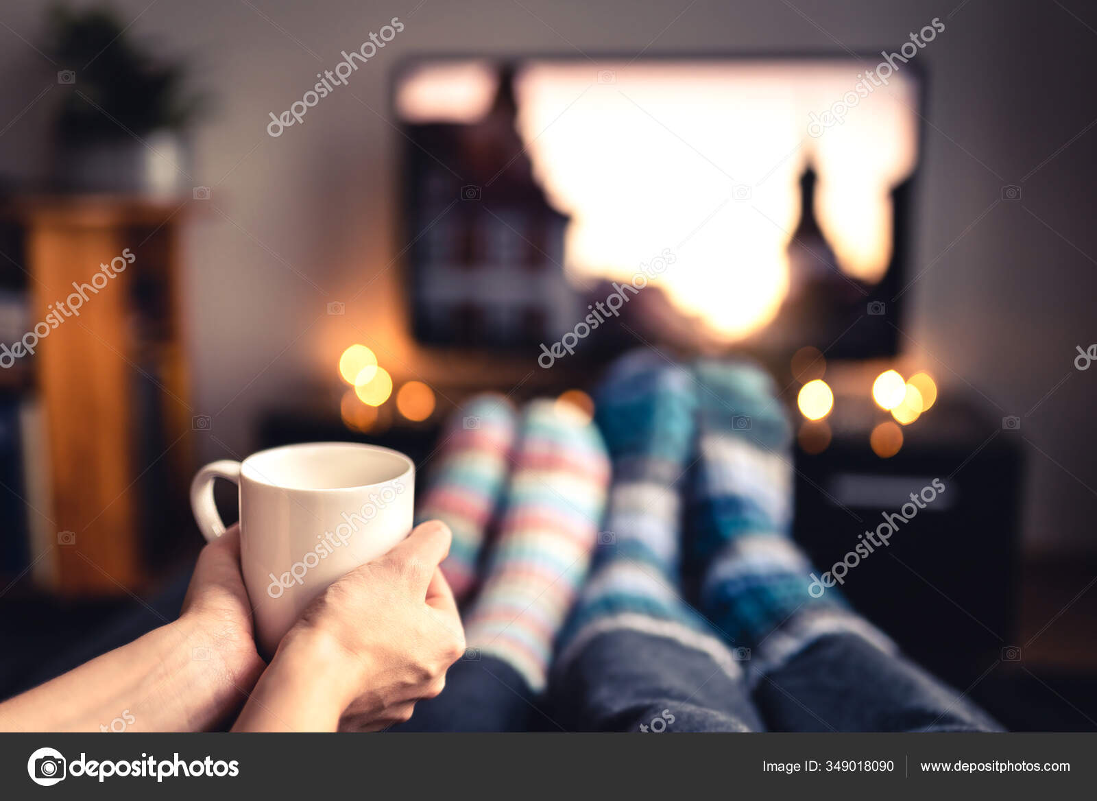 Enjoying Warm Tea In Cozy Sock On A Cold Autumn Day Stock Photo