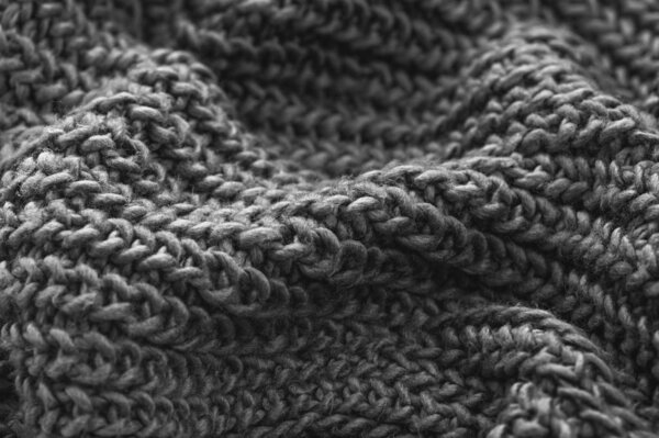 Monochrome knitted fabric closeup. Knitted wool background. Handmade. — Stock Image Monochrome knitted fabric closeup. Knitted wool background. Handmade. — Stock Photo, Image