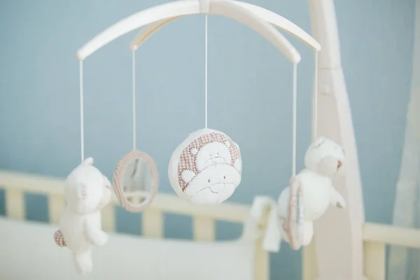 Baby pendant over the bed to soothe the baby. The first toys for the baby.