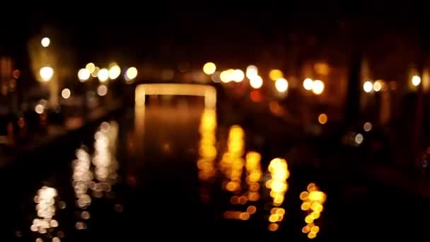Illuminated bridge spanning canal — Stock Video