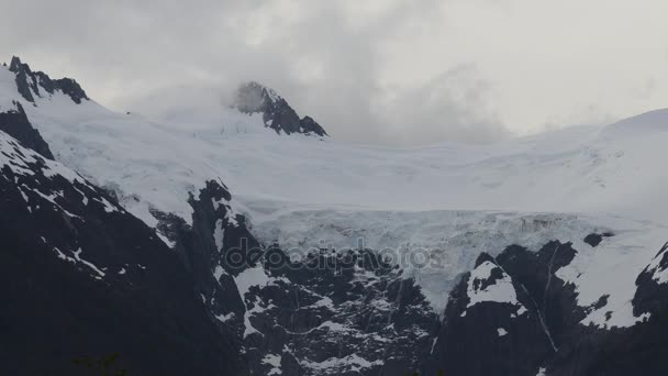 Rugged mountains buried in deep snow — Stock Video