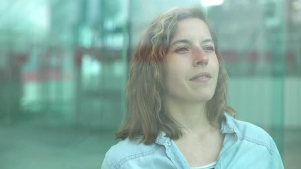 Woman gazing through window — Stock Video