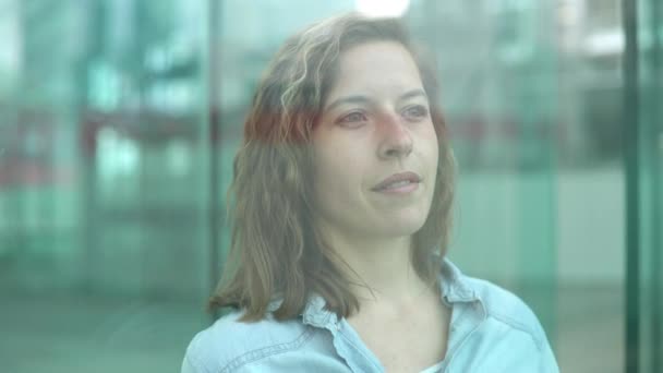 Woman looking through window — Stock Video