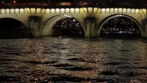 Bridge spanning over Seine River at nigh — Stock Video