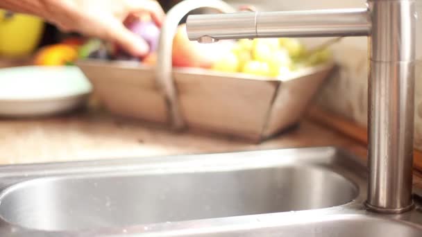Woman washing plum — Stock Video
