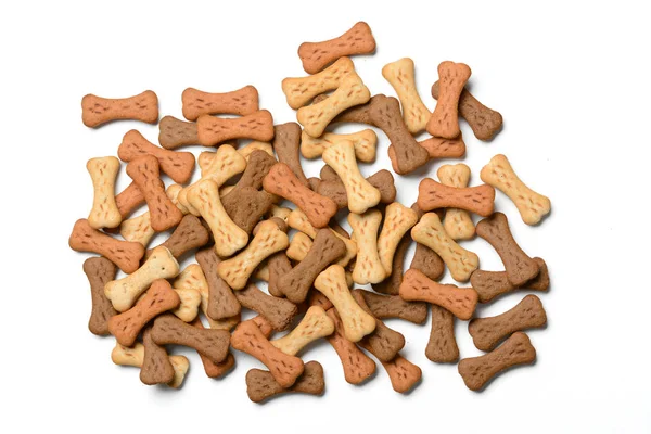 Dog biscuits in the shape of bones in white background — Stock Photo, Image