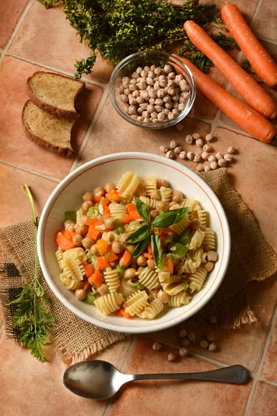 Pasta with chickpeas, carrots and celery — Stock Photo, Image
