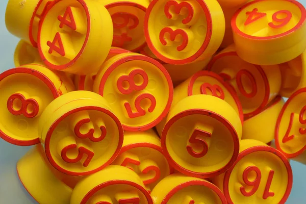 Pile of bingo numbers in the foreground — Stock Photo, Image
