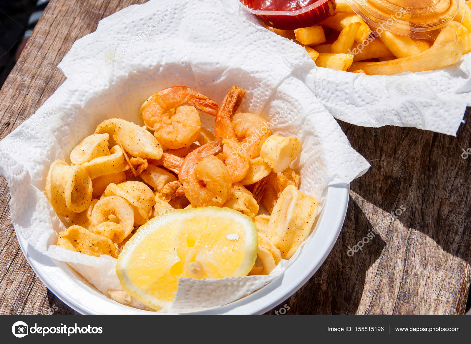 Crispy fresh squid and shrimp in white plate. — Stock Photo © Jukov