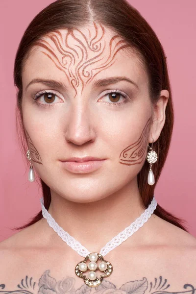 Elven girl with drawings on her face — Stock Photo, Image