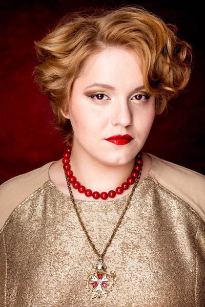 Beautiful fat girl with honey-colored hair on a black background — Stock Photo, Image