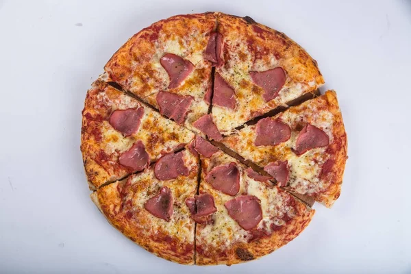 Chopped pizza with ham — Stock Photo, Image