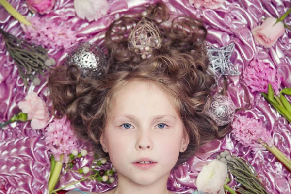 Small Fair Haired Girl Lying Pink Silk Fabric Christmas Garland — Stock Photo, Image