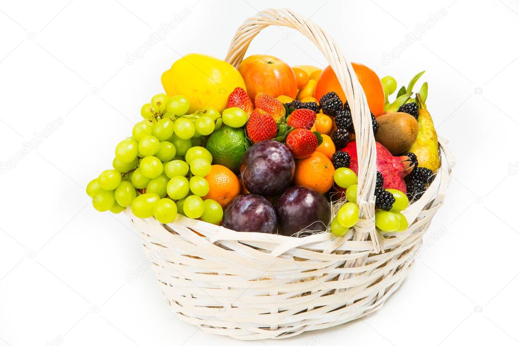 basket with fruits and berries, decorated with shiny flowers