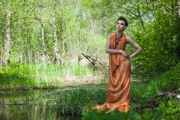 Slim Brunette Orange Dress Standing Shore Forest Pond — Stock Photo, Image