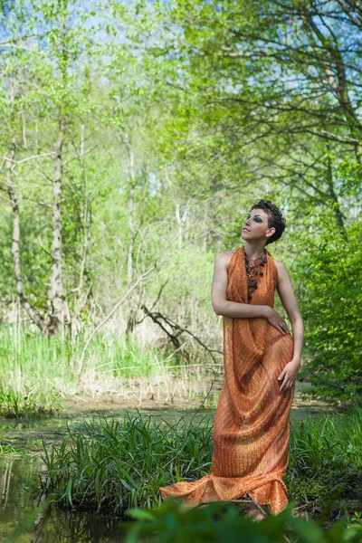 Slim Brunette Orange Dress Standing Shore Forest Pond — Stock Photo, Image