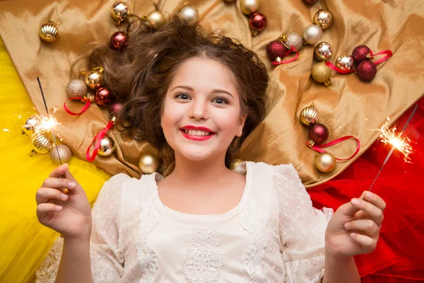 Girl White Elegant Dress Candy Her Hands Lies Gold Background — Stock Photo, Image