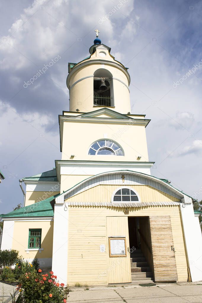 Orthodox church with a bell and white walls
