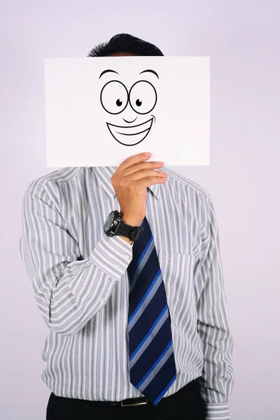 Junger Geschäftsmann mit breitem Lächeln, Maske auf weißem Hintergrund — Stockfoto