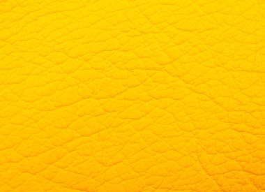 Deri dokular ya da soyut sarı arkaplan olarak parlak sarı deri bir makro çekim