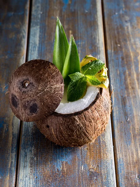 Coconut cocktail on the wood table — Stock Photo, Image